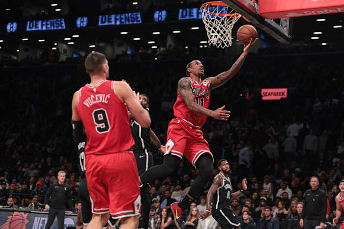 Bulls forward DeMar DeRozan shoots a layup.